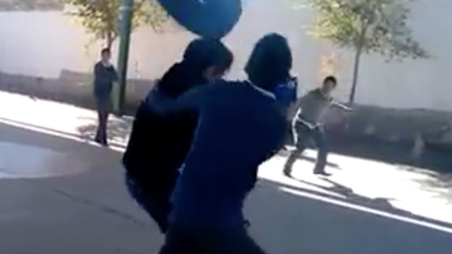 FAIL! Guy attempts to throw tire at two friends