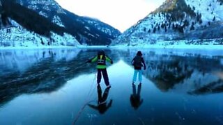 Family ice skates in beautiful landscape