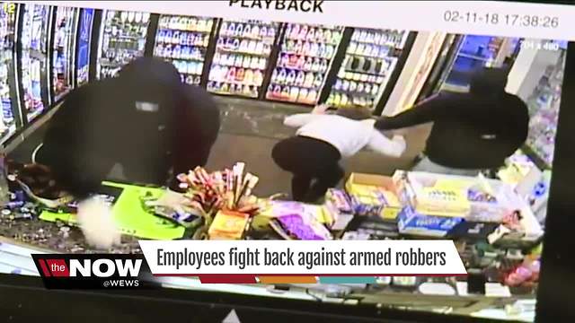 Akron convenience store workers fight back against armed robbery suspects during violent attack