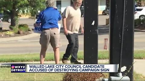 Petty Politics or clumsiness? Councilman caught knocking over opponent's sign