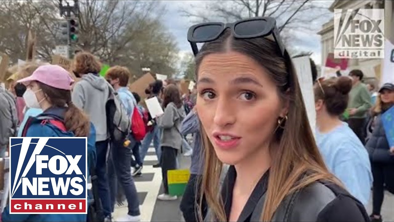 Activists march through DC demanding Biden declare a climate emergency