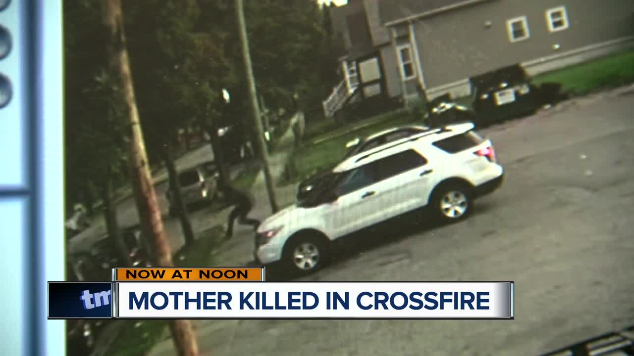 Surveillance footage shows how a mother of 2 was caught in the crossfire