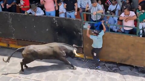 Angry bull hit a boy in festival.