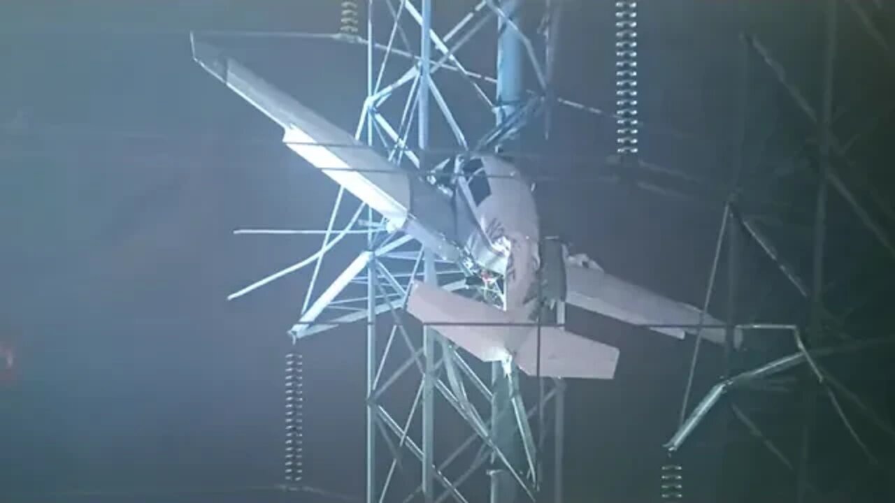 Light aircraft lands in electricity pylon.