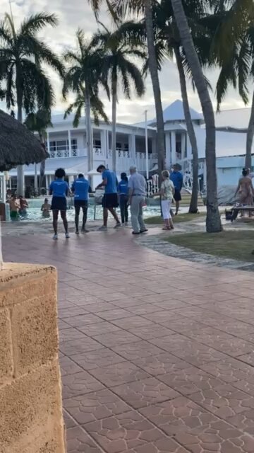 Couple dancing on vacation showing snake hips how to do it!