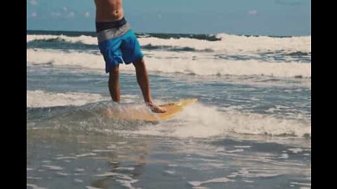 Man crosses entire lake on a skimboard