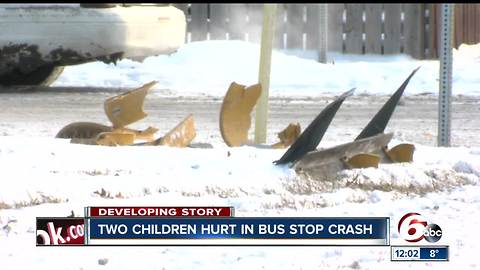 2 children, 2 adults injured as car slides into bus stop on Indy's northeast side