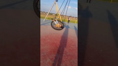 Cute baby on a park swing. #viral #shorts #youtubeshorts #fun