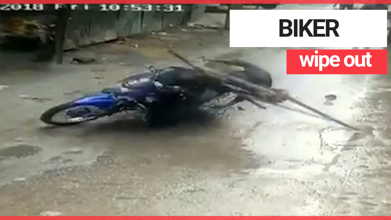 Biker wiped out iron frame that fell from above