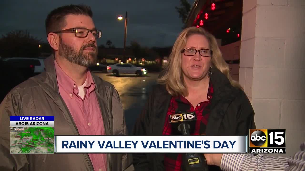 Couples brave rainy night in Phoenix for Valentine's Day