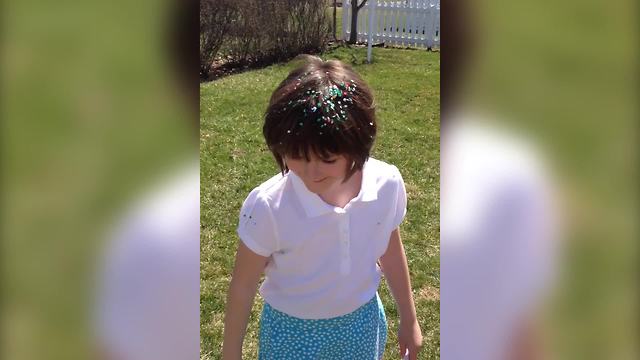 A Cute Girl With Confetti On Her Head