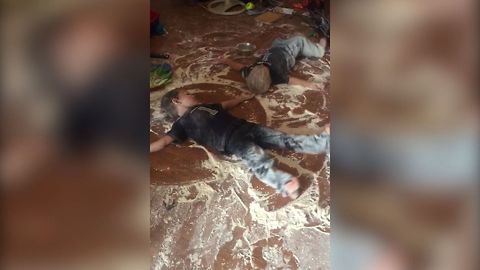 Toddlers Make Flour Snow Angels