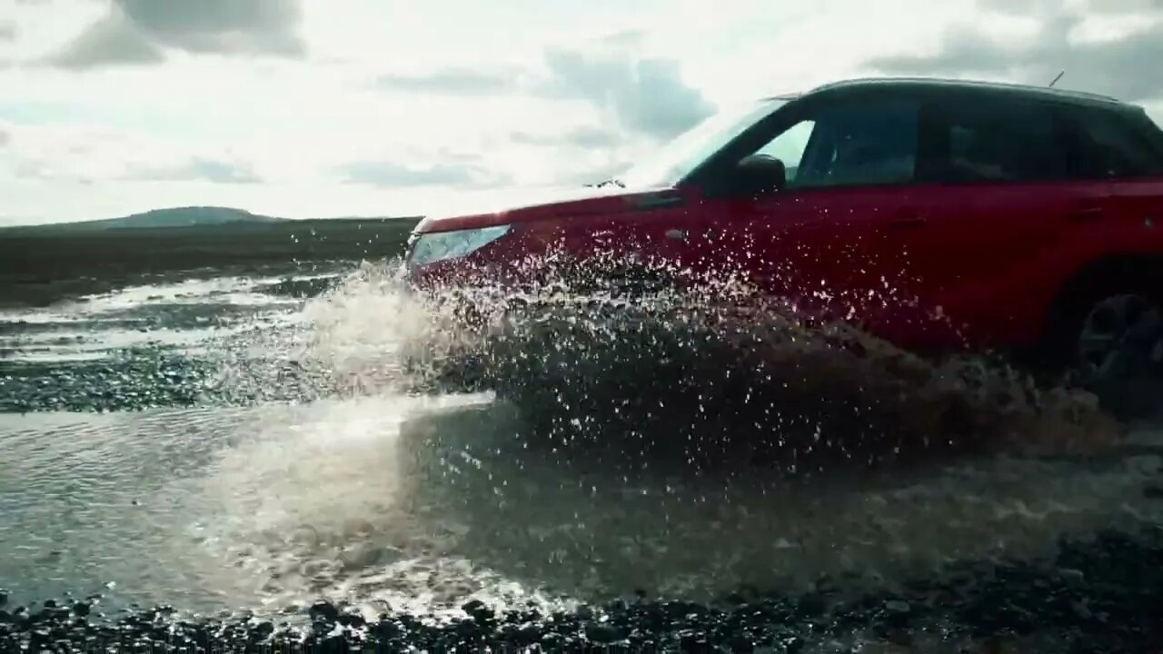 Car Driving Through Puddle In Slow Motion