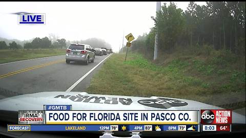 Familiar long lines string around Pasco fairground for disaster food program