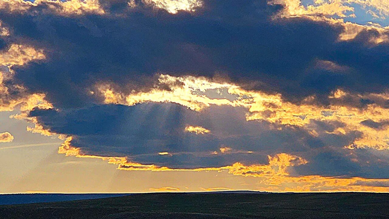 "Fingers of God", Timelapse of light rays and rainstorm. Drone footage. ArtForOUR.org