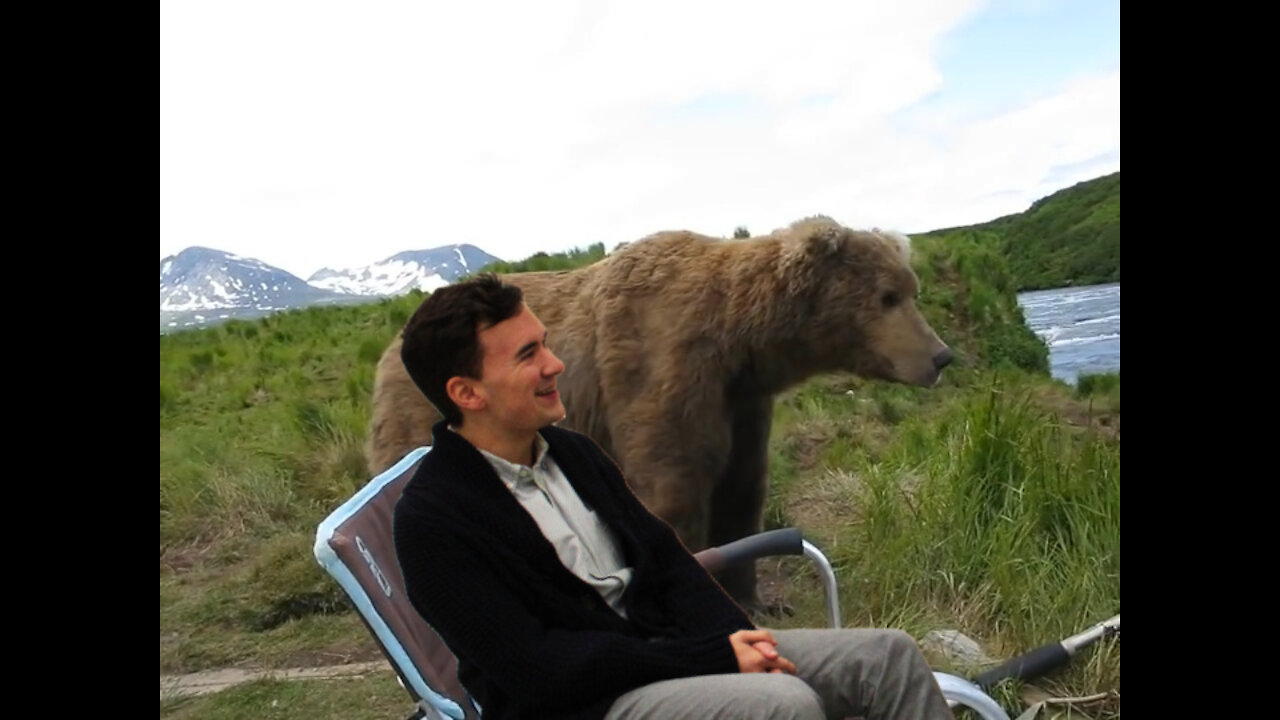 Bear surprises fisherman during lake fishing