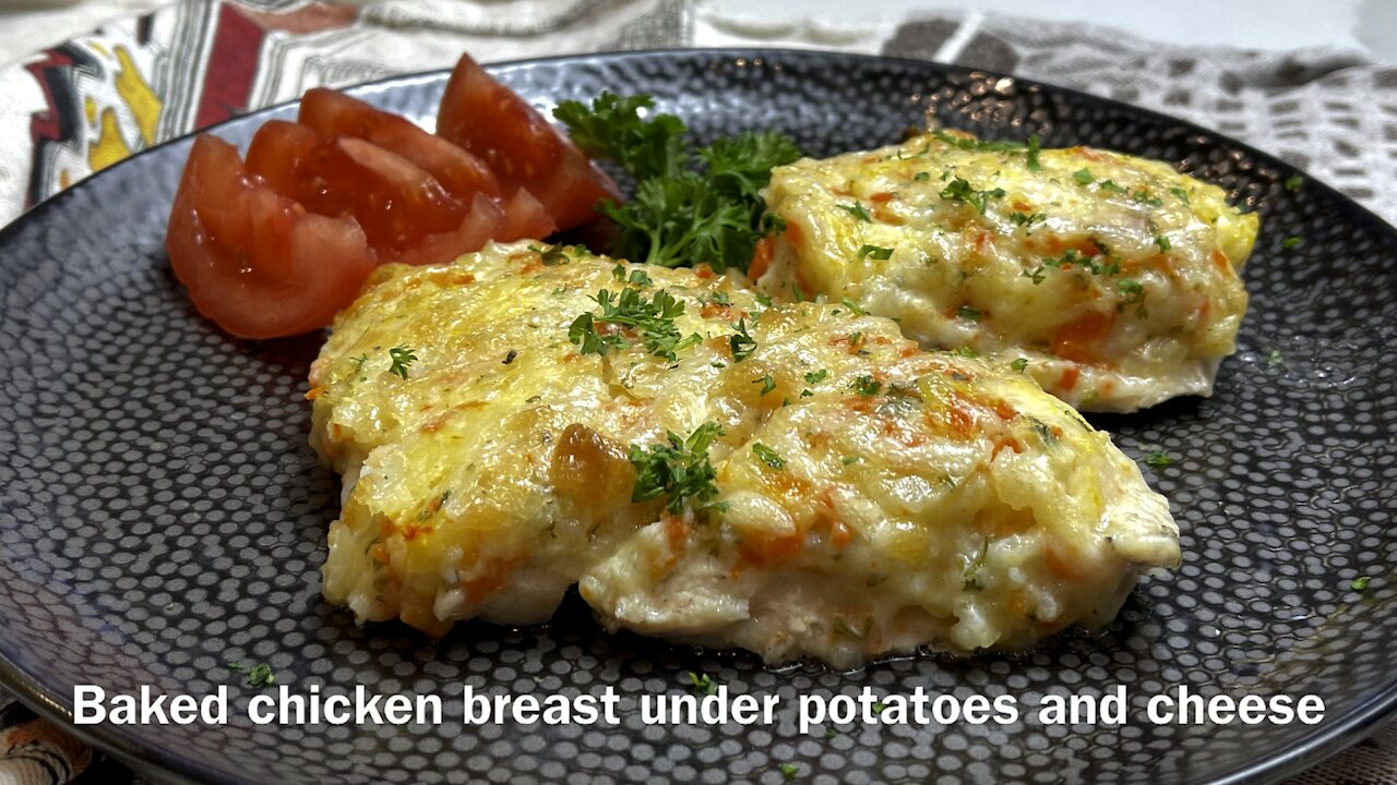 Tender and juicy Chicken breast under potatoes and cheese