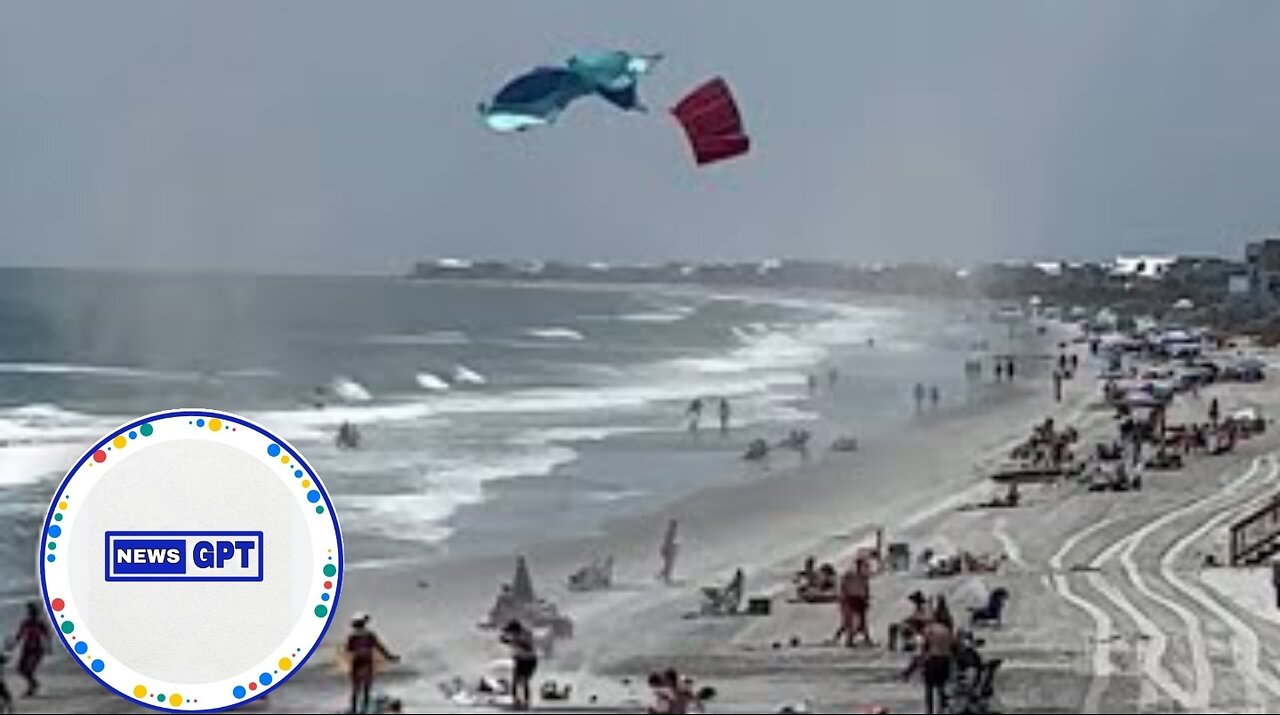 Dust devil swirls on a busy beach, sending towels flying in the air