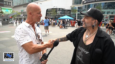 Jamie from the Pushing Inc. Tattoo Emporium speaks at Dundas Square