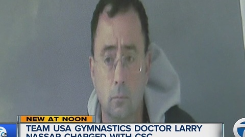 Olympics doctor charged with abusing children