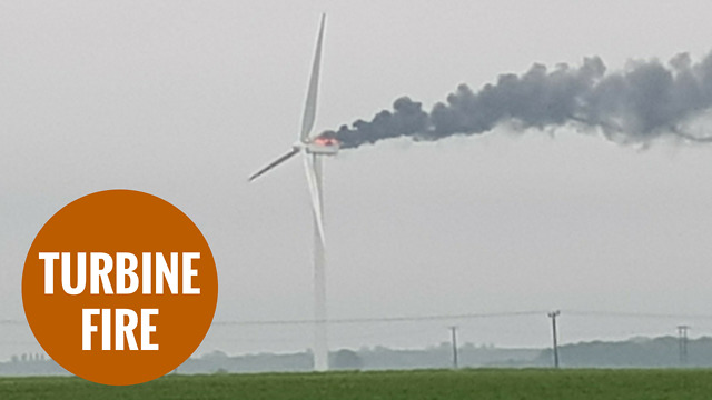 A wind turbine catches fire after thunder and lightening strikes