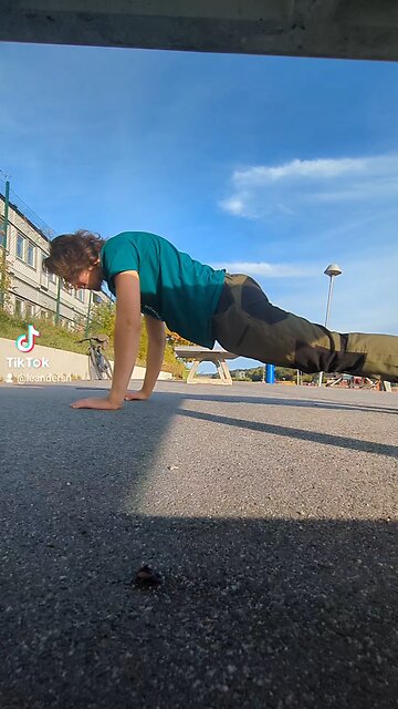 Doing spiderman pushups Doing spiderman pushups