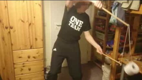 Young man juggles toilet paper with diabolo sticks