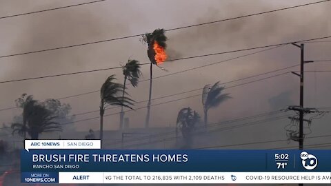 Two brush fires erupt in San Diego County and threaten homes