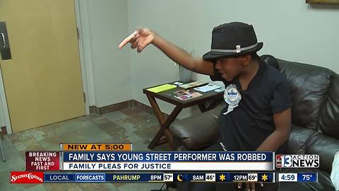 Family says 8-year-old street performer was robbed