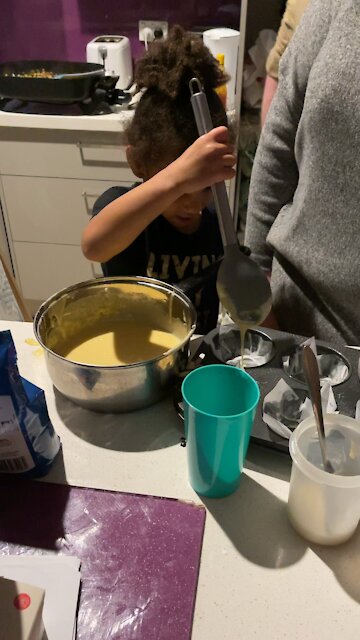 Daughter learning to make cupcake
