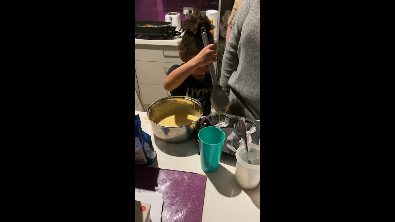 Daughter learning to make cupcake