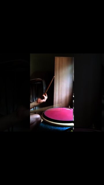 Hand drumming technique using the traditional drum hand grip.