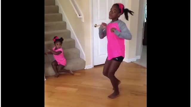 Toddler Steals Sister’s Solo Dance Show Without Noticing