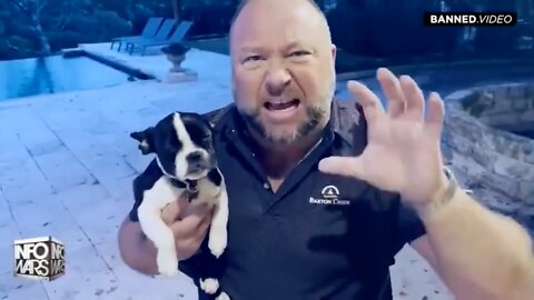 Alex Jones strangles puppy