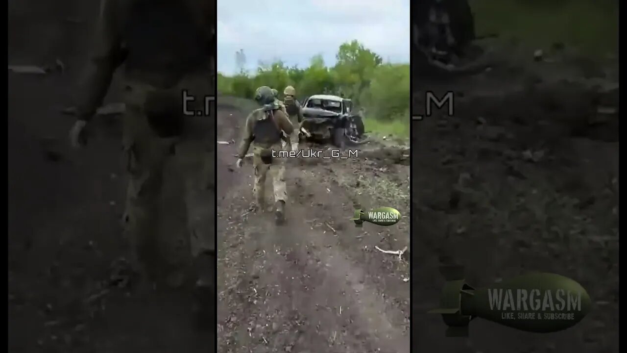 Two wrecked Ukrainian pick up trucks by the highway