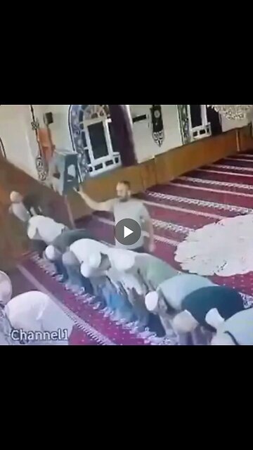 A guy hitsvthe imam on the head several times with a plastic stool...