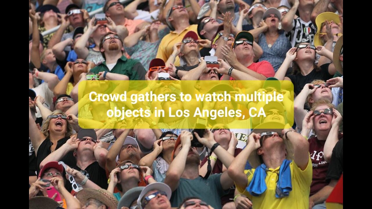 Crowd gathers to watch multiple objects in Los Angeles, CA