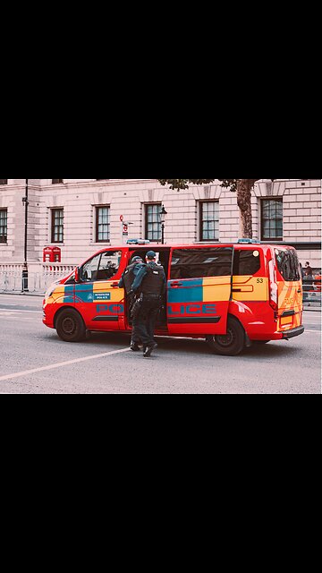 Young man with end police brutality sign standing outdoors in city, Melanin lives matter concept.