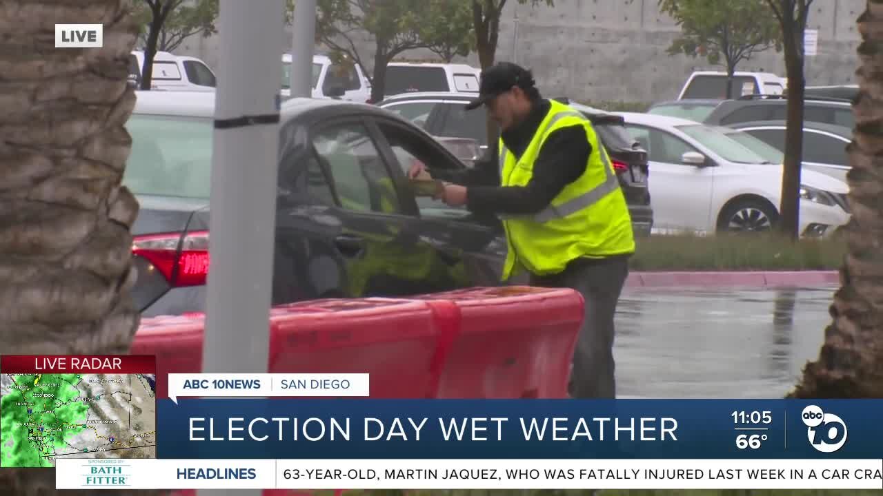 Voters head to the polls during wet weather