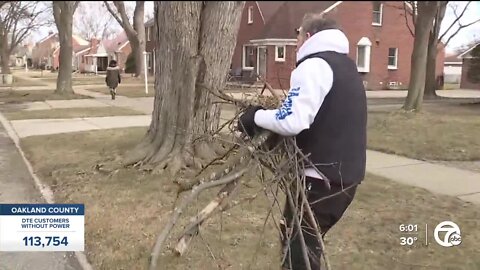 Neighbors in Allen Park begin cleanup, power through second day of outage
