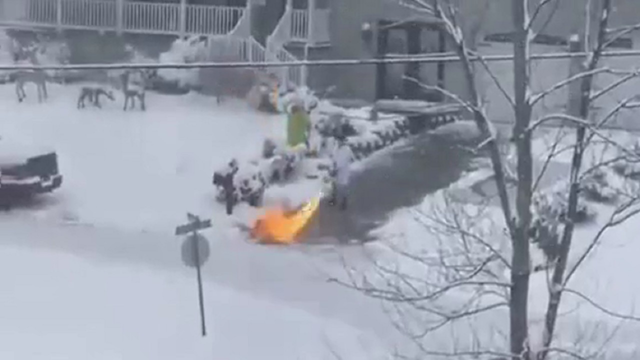 Someone is cleaning snow off his driveway with the help of a flamethrower