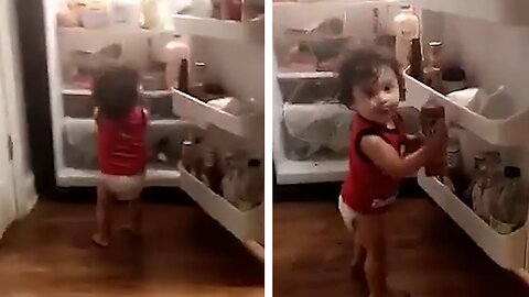 Hungry Baby Gets Caught Sneaking Food Right Out Of The Fridge