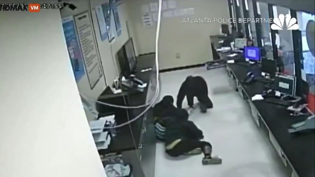 Masked Robbers Fall Through A Ceiling During A Robbery At An Atlanta Check-Cashing Store