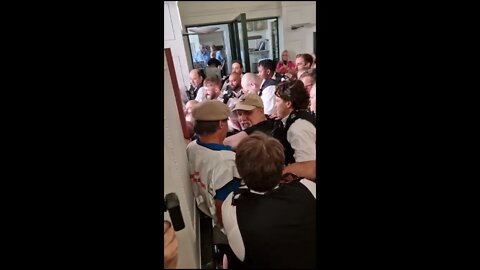 Government agents using brute force to deny citizens access to a public building.
