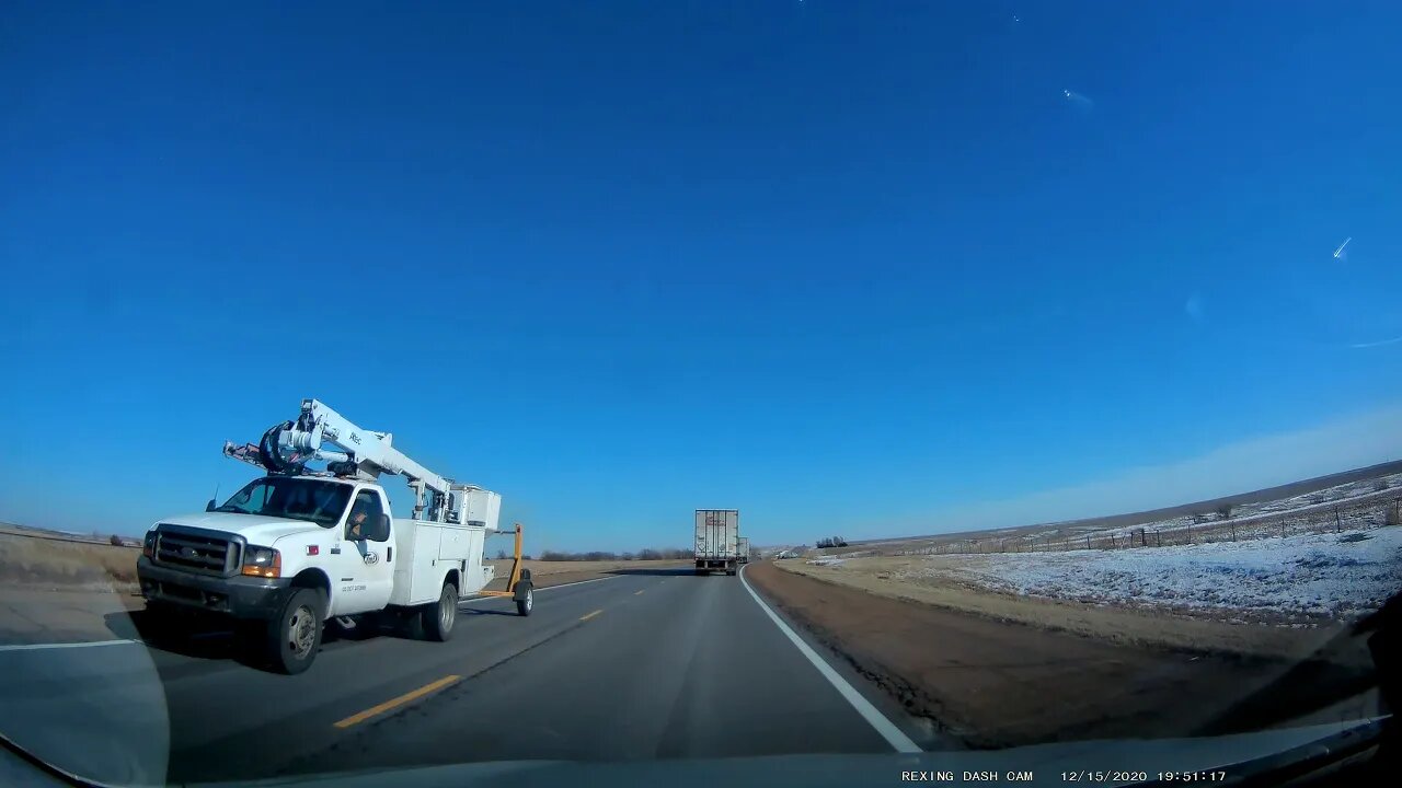 Semi passing 3 semis and a truck up hill