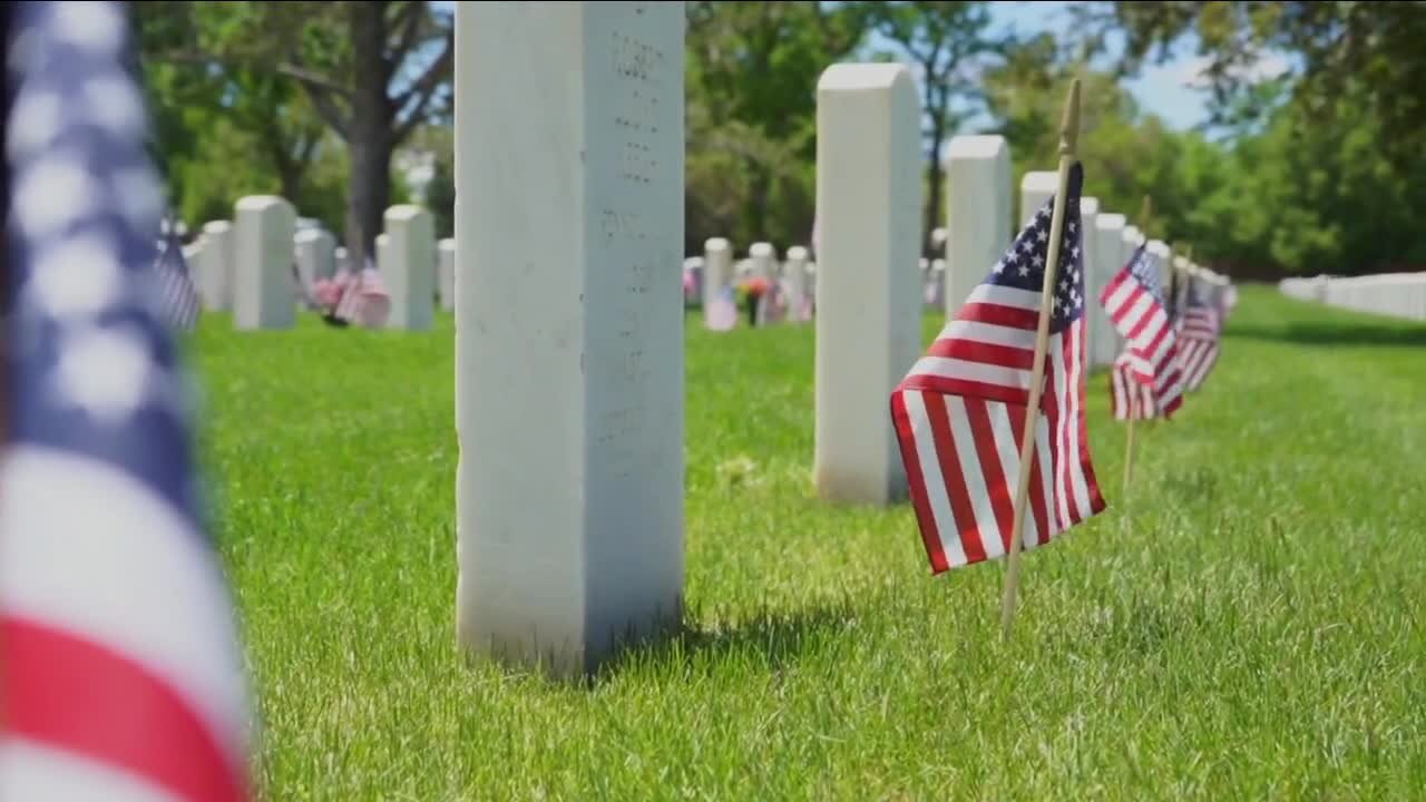 Families remember their loved ones during Memorial Day ceremony at Fort Logan National Cemetery