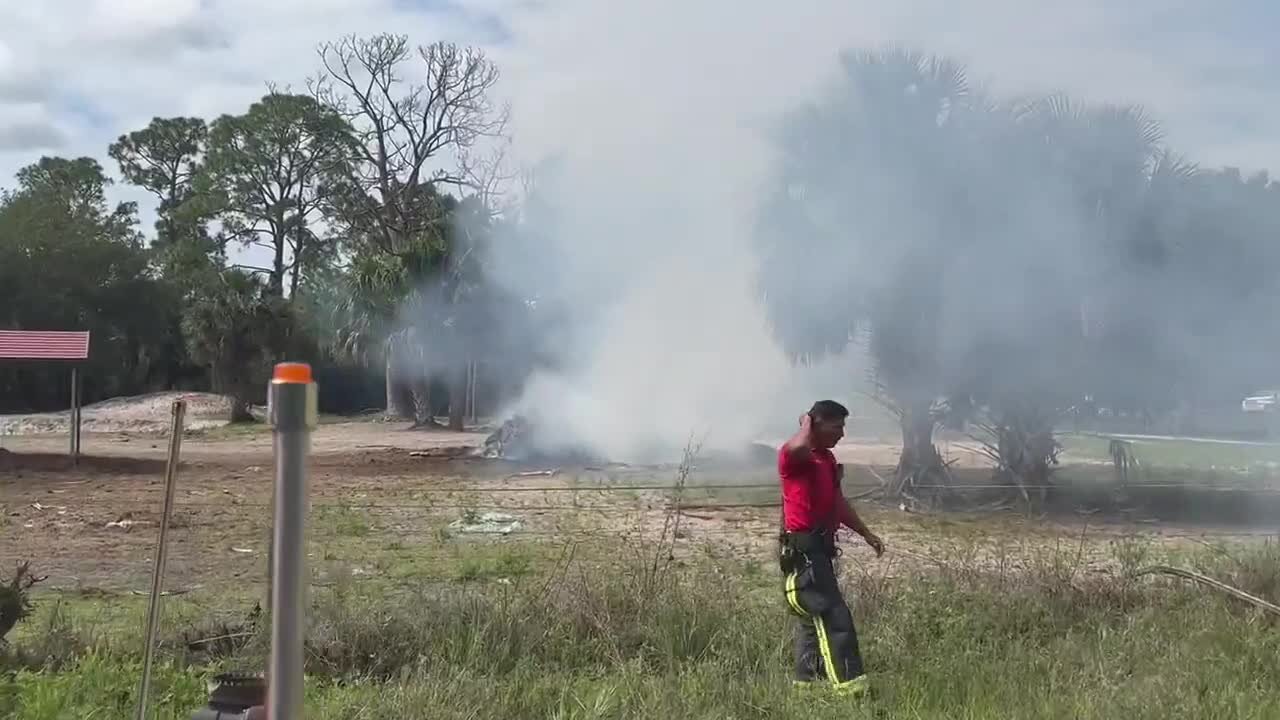 Crews work to extinguish yard debris fire in Lehigh Acres