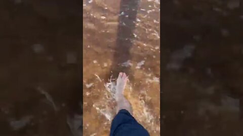 Walking through water at the beach