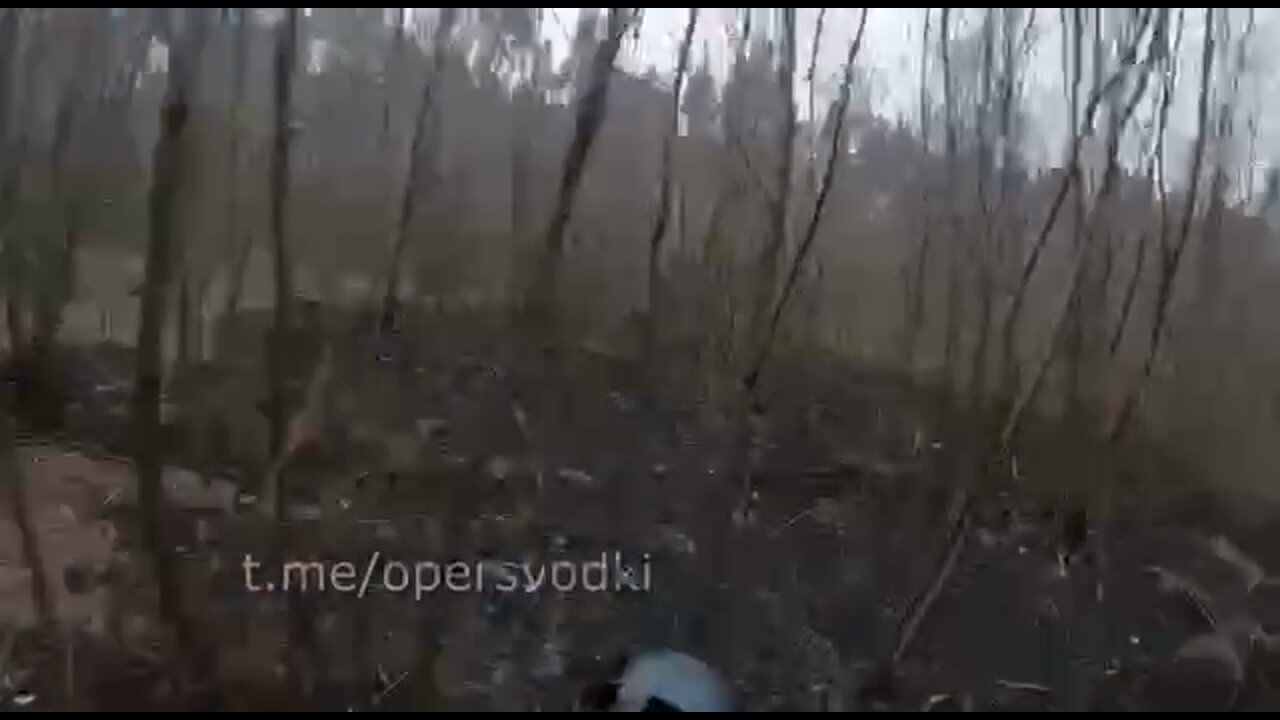 Ukrainian squad carrying anti-tank weapons takes cover when shots are heard