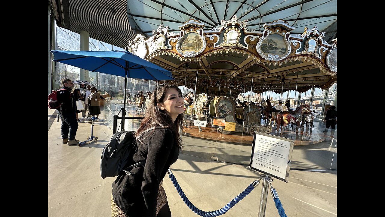 Taking a ride on Jane’s Carousel in Brooklyn.